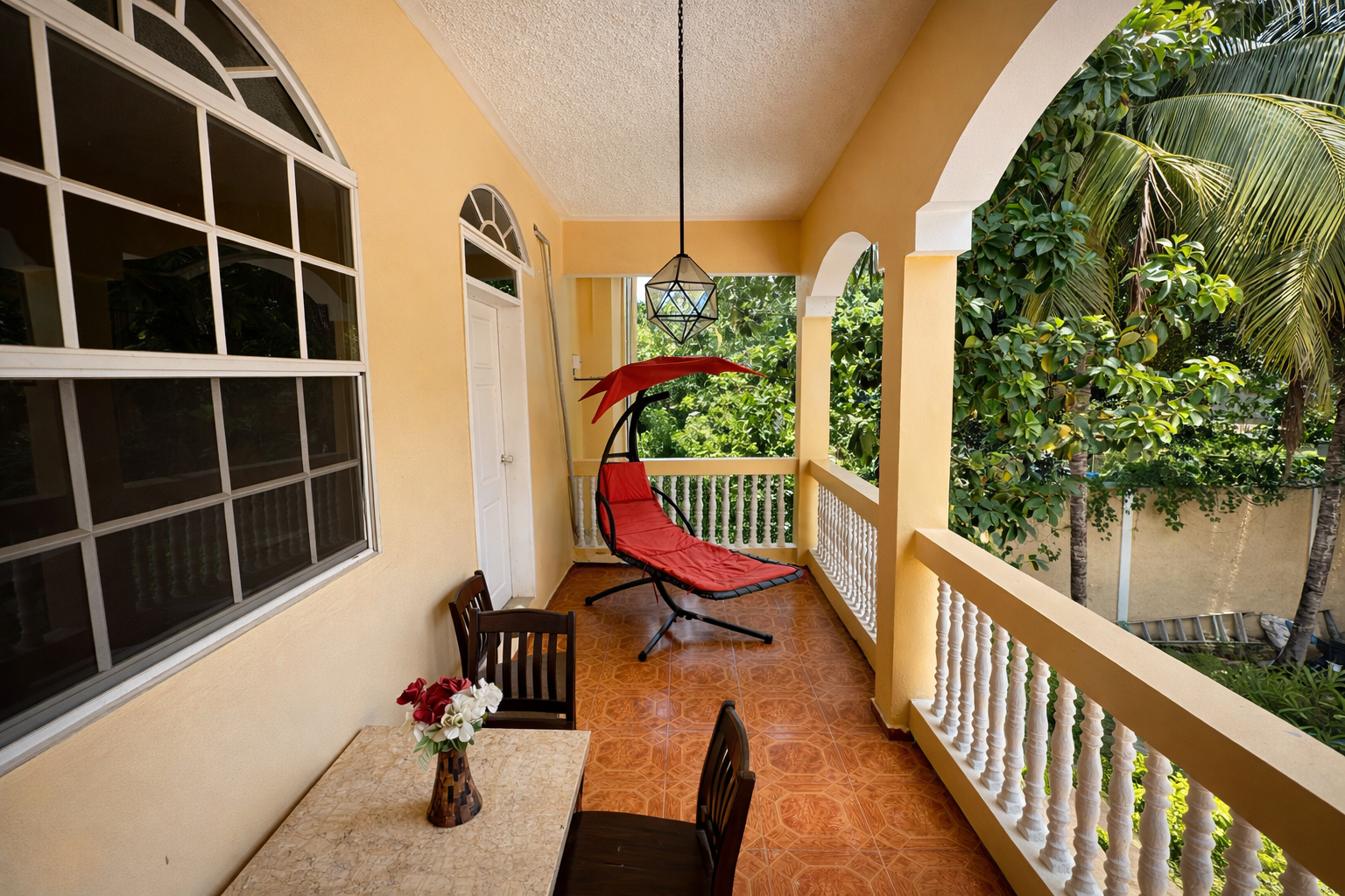 Private balcony tropical relaxation at Hidden Palace Guesthouse Cap Haitien